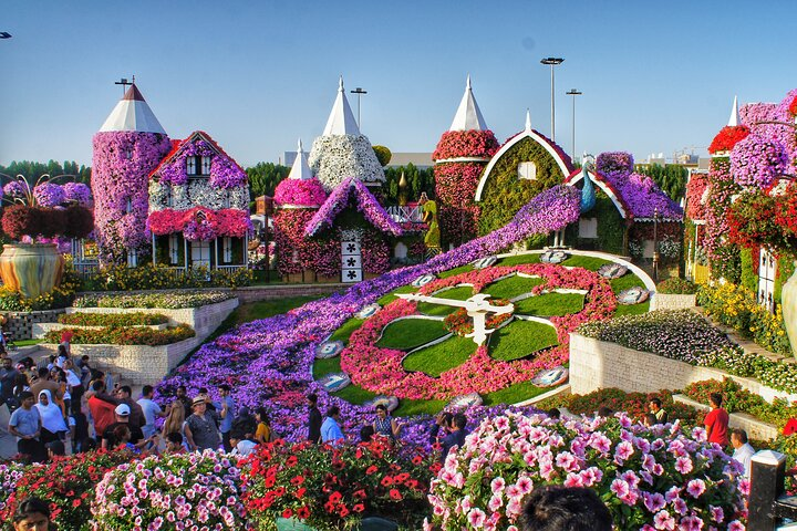 Explore the stunning array of colors and intricate floral designs at the Dubai Miracle Garden where over 150 million blooms create a visually striking experience for every traveler.
